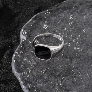 Detailed view of S925 sterling silver stamp on the inner band of the black stone ring