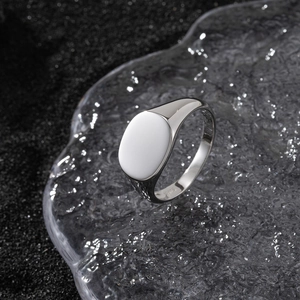 Macro detail of S925 sterling silver ring with oval inlay on ice crack textured background