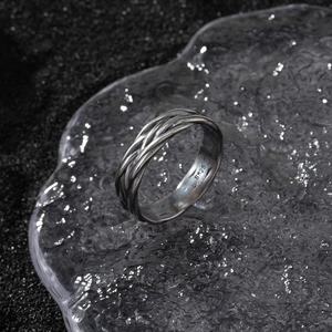 Macro detail of S925 sterling silver ring showing intricate woven texture and vintage finish