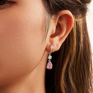 S925 sterling silver hoop earrings with pink pear cut zircon drop worn on ear