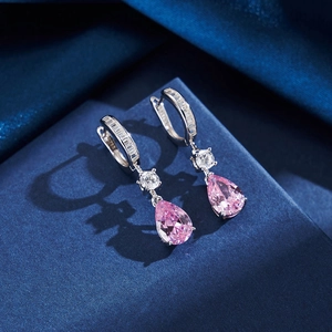 Macro shot of S925 silver earrings featuring pink pear-cut stones and clear zircon detail