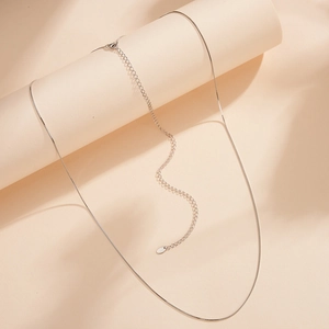 Macro detail of S925 sterling silver box chain with lobster clasp and extender