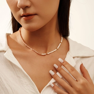 Elegant S925 silver necklace with white pearls and pink gemstones on model neck