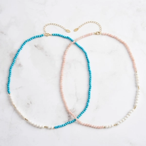 Detail view of pink and blue faceted beads with white pearls on S925 silver necklaces