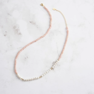 Close-up of S925 silver necklace with pink opal stones, pearls and gold lobster clasp