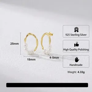 Handcrafted S925 sterling silver golden wave earrings featuring baroque freshwater pearls