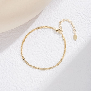 Close-up of a double-layered S925 sterling silver gold-plated bamboo-style link bracelet