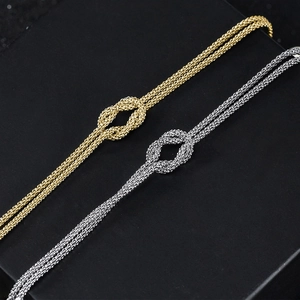 S925 sterling silver beaded heart bracelet set in gold and silver woven knot design