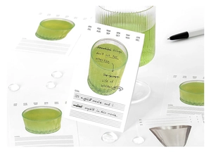 Minimalist green sticky note with monthly markers and goal section for journaling
