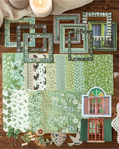 Close-up of vintage garden floral scrapbooking kit with paper frames and cutouts