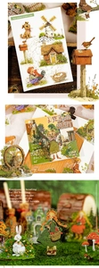 Macro detail of pastoral themed PET stickers featuring windmills and country houses