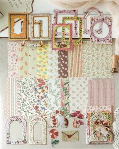 Detailed spread of vintage floral scrapbook paper stickers with various frames and motifs