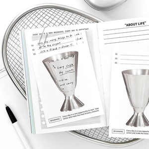 Minimalist DIY stationery set with grid notepad and aesthetic quote cards on metal tray