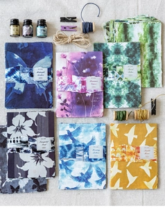 Flat lay of vintage tie-dye scrapbooking paper with butterflies and floral motifs