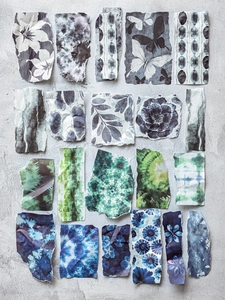 Artistic tie-dye collage paper with floral and butterfly patterns for scrapbooking
