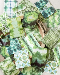 Flat lay of Forest Series tie-dye decorative papers with botanical prints and raw edges