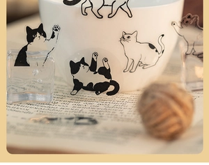 Detail of transparent waterproof cat stickers with minimalist black and white hand-drawn designs