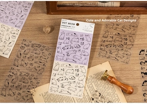 Detail of PET cat stickers on vintage book paper for scrapbooking and decoration