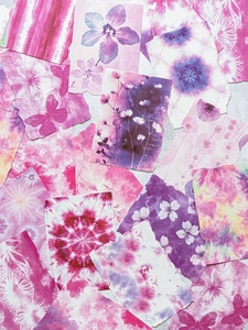 Detail of vintage pink tie-dye scrapbook paper with floral and butterfly patterns