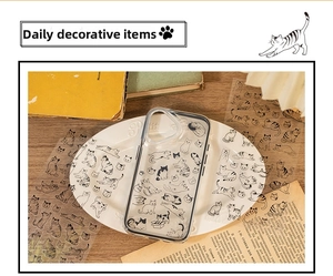 Detailed view of clear TPU phone case featuring adorable black and white cat illustrations