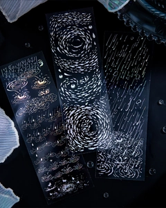 Macro view of long PET decorative stickers with holographic fish and ripple patterns