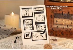 Close-up of cat themed stickers and decorative cards for scrapbooking and journal art