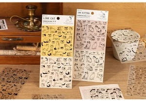 Close-up of decorative PET cat stickers in line art and ink style for DIY crafts