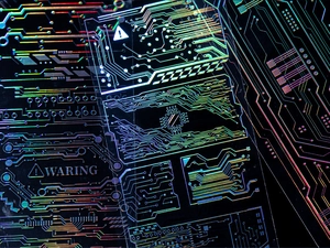 Macro shot of laser holographic circuit board stickers with cyberpunk tech patterns