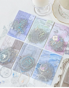 Detailed view of vintage silver foil PET stickers with floral and butterfly designs