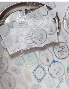 Macro shot of vintage PET stickers with holographic details for DIY journaling