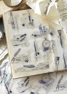 Detailed close-up of vintage PET stickers featuring pens and watches for journaling