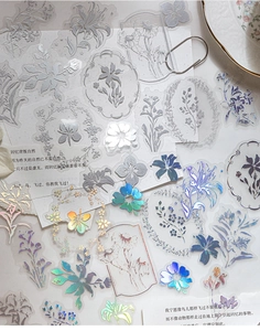 Macro detail of PET floral stickers with silver frosting and laser gold foil textures
