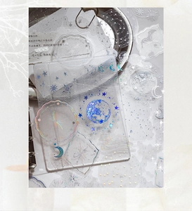 Macro shot of PET stickers with holographic polarising effects for journaling decoration