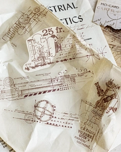 Macro shot of vintage industrial PET stickers with technical drawings on aged paper