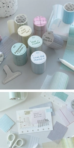 Detailed display of plaid and striped washi tape set for creative bullet journaling
