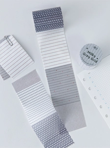 Detail of Milky Grey Grid washi tape with dots and grid patterns for journaling decoration
