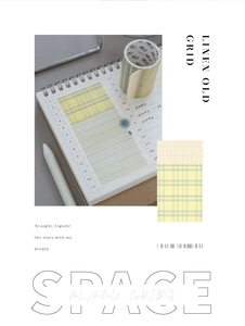 Detail of yellow grid and linen texture washi tape for minimalist scrapbooking decoration