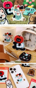Close-up of fluffy towel embroidery cartoon animal patches with 3D texture and adhesive back