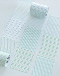 Close-up of minimalist plaid and striped washi tape in pastel green and lavender colors