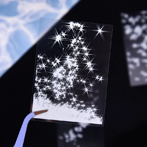 Sparkling white star pattern PET stickers for journaling shown with blue tweezers