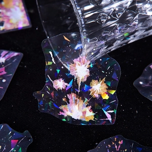 Holographic fireworks PET stickers with shimmering laser finish on dark background