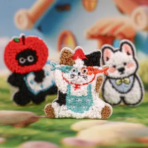 Three cute cartoon animal embroidery patches featuring cats and a puppy for DIY crafts
