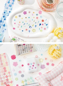 Detail of colorful geometric PET stickers used for decorating notebooks and AirPods cases