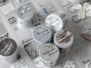 Detail of PET decorative tape rolls with vintage floral and feather aesthetic patterns