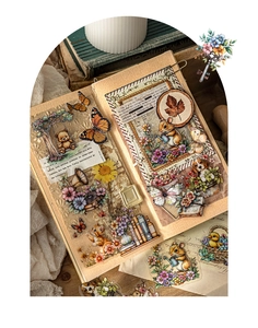 Detail of PET garden stickers with retro animals and vintage floral motifs in a scrapbook
