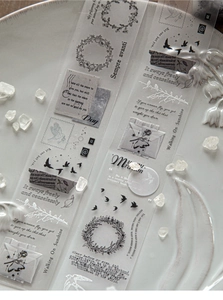 Macro detail of transparent PET tape with vintage floral and artistic script patterns