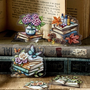 Vintage PET floral stickers with hydrangea and butterfly motifs on antique book backgrounds