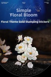 Detail of floral hot stamping stickers with elegant golden outlines on dark blue aesthetic