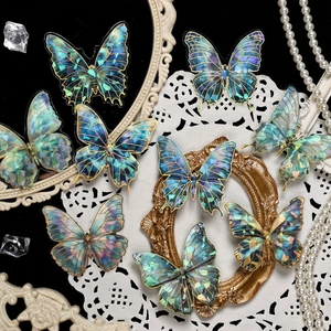 Butterfly scrapbooking stickers with holographic blue wings and golden foil borders