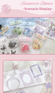Close-up of laser-cut hollow lace paper and butterfly stickers for scrapbooking decor